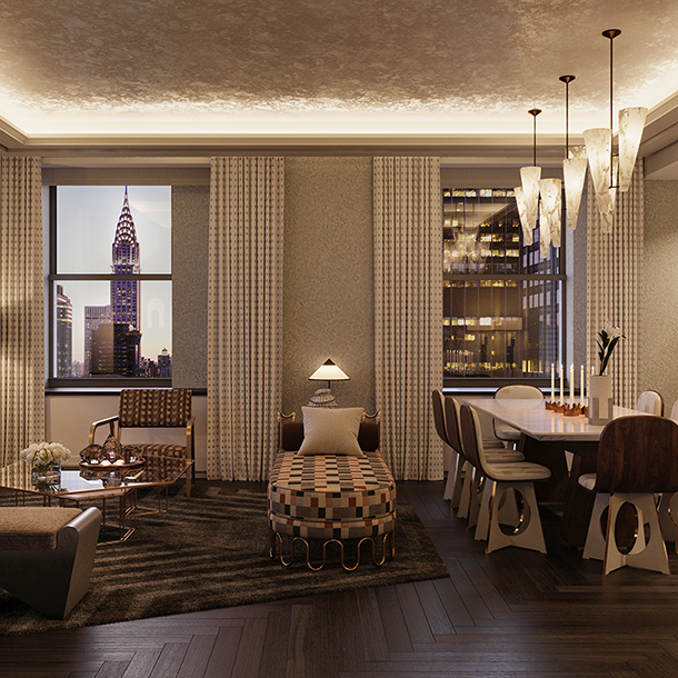 Luxurious great room in one of the residences at the Waldorf Astoria Residences in New York. The room has a sofa, armchair, coffee table, chaise, dining table and windows with views of the Empire State Building and New York city.